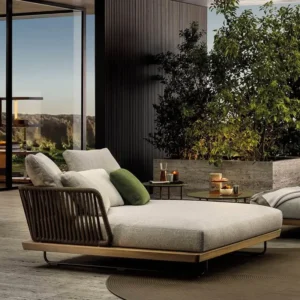 Outdoor lounger with water-resistant cushion