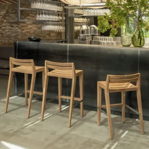 Outdoor Teak Bar Chairs Outdoor teak bar chairs in a modern outdoor bar setting