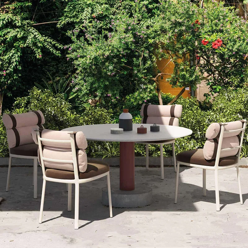 Outdoor Dining Furniture Set Outdoor dining chairs and table in garden setting