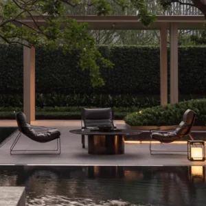 Outdoor Lounge Chairs by Pool Outdoor lounge chairs and round table beside a pool