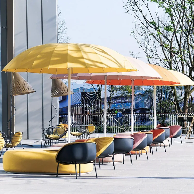 Large Outdoor Patio Umbrella Large outdoor patio umbrellas in a commercial seating area