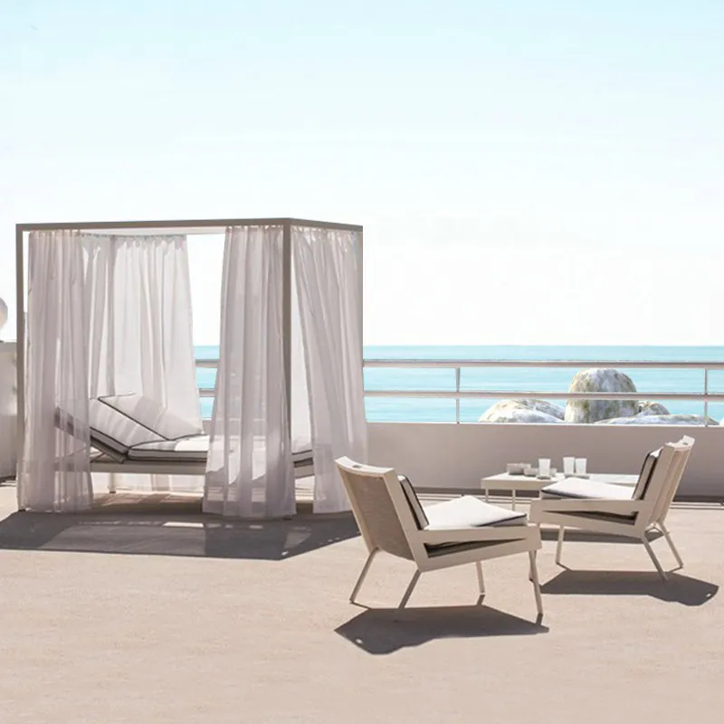 Outdoor rattan lounge chairs by the sea