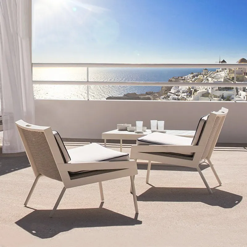 Teak and rattan outdoor lounge chairs