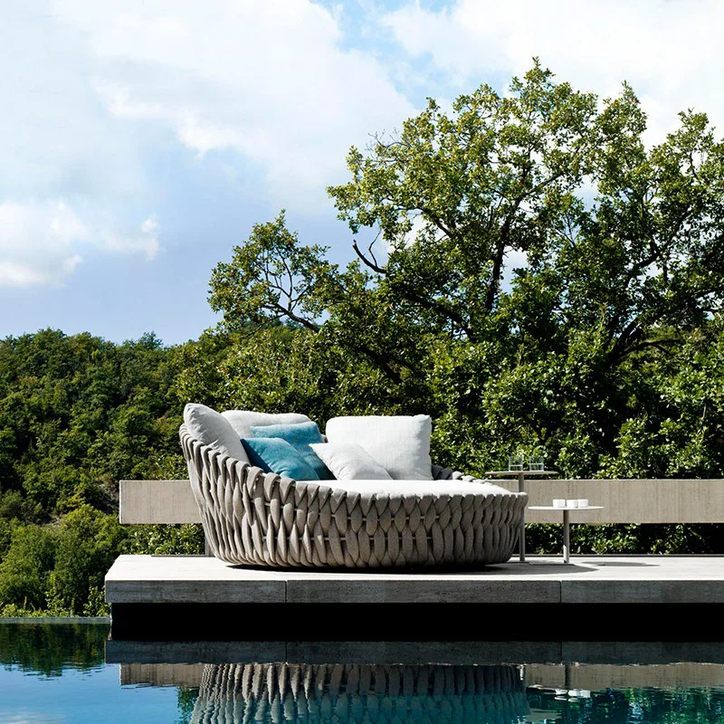 Round Outdoor Daybed by the Pool Round outdoor wicker daybed by the pool