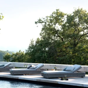 Poolside Outdoor Wicker Daybeds Outdoor wicker daybeds on a poolside terrace